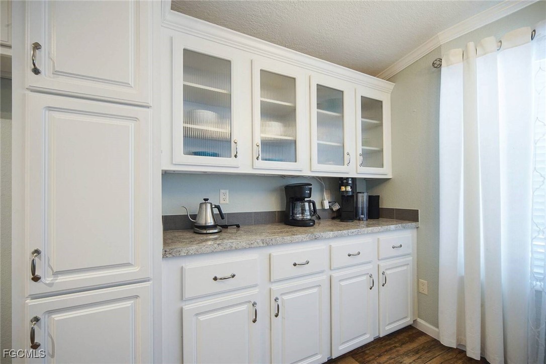 2831 York Road St. James City, FL 33956 - Photo 22 of 29 a kitchen with stainless steel appliances granite countertop white cabinets and a sink
