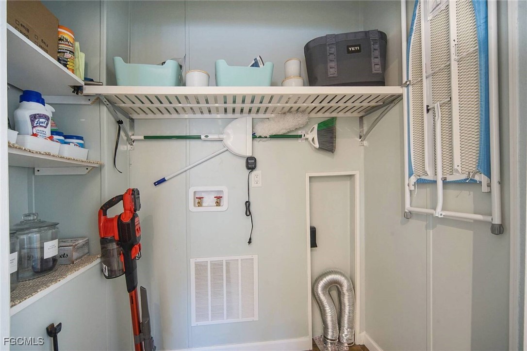2831 York Road St. James City, FL 33956 - Photo 23 of 29 a utility room with a window