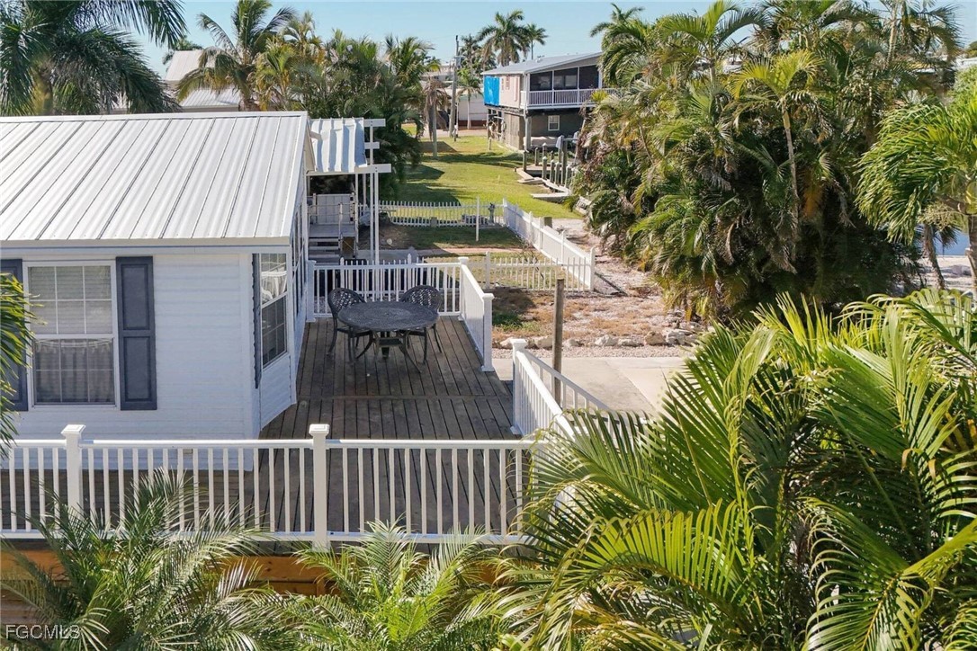 2831 York Road St. James City, FL 33956 - Photo 4 of 29 a view of a chair and table in the balcony
