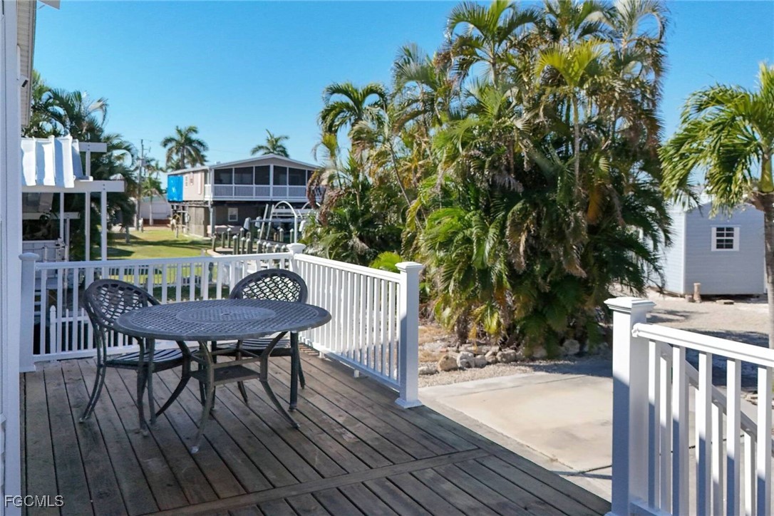 2831 York Road St. James City, FL 33956 - Photo 7 of 29 a balcony with table and chairs