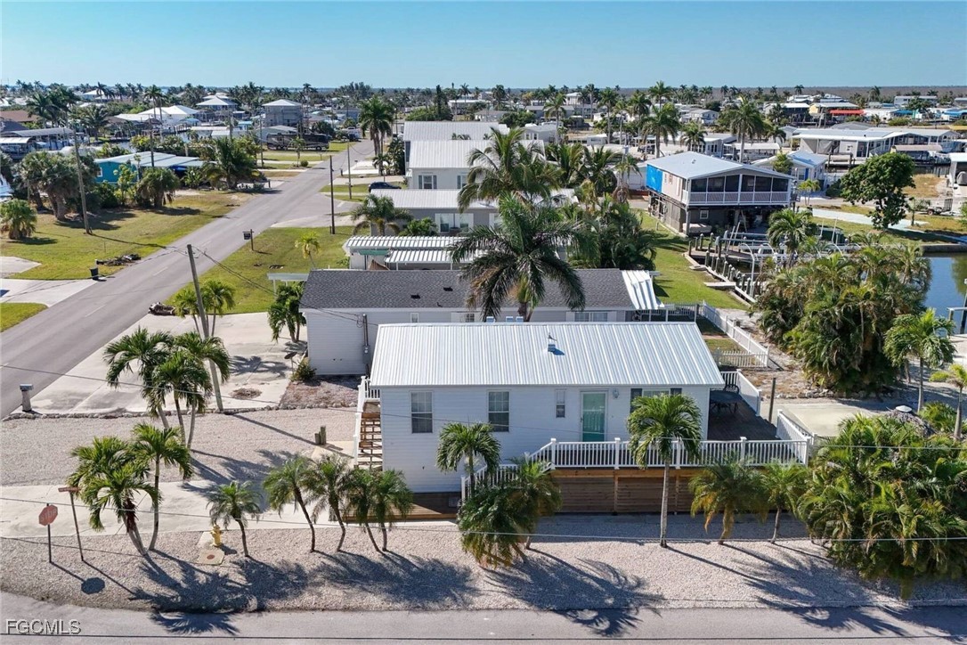 2831 York Road St. James City, FL 33956 - Photo 9 of 29 an aerial view of a house with garden space and ocean view