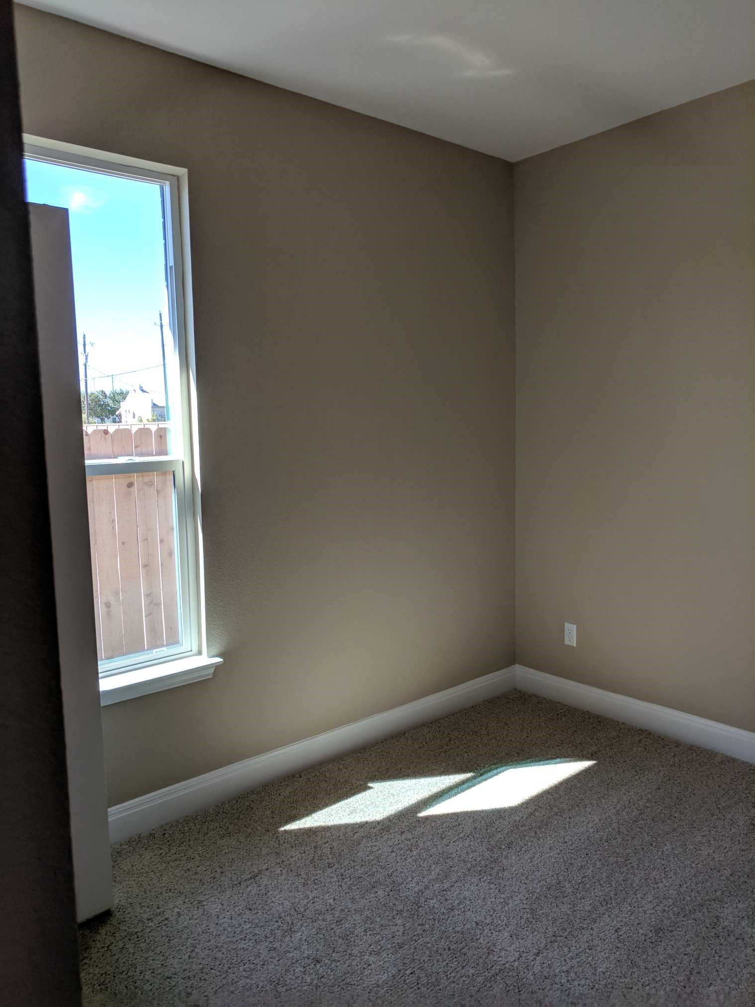 2471 Sunrise Road, Unit 8 Round Rock, TX 78664 - Photo 8 of 13 Neutral-toned walls complement plush carpeting