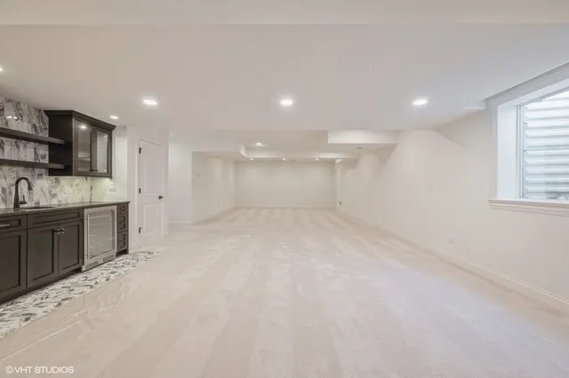 a view of a kitchen with a sink and dishwasher stove top oven