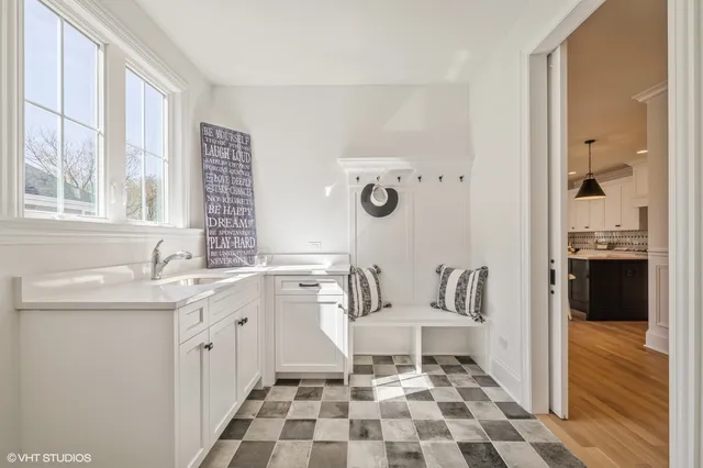 a spacious bathroom with a granite countertop sink and a mirror