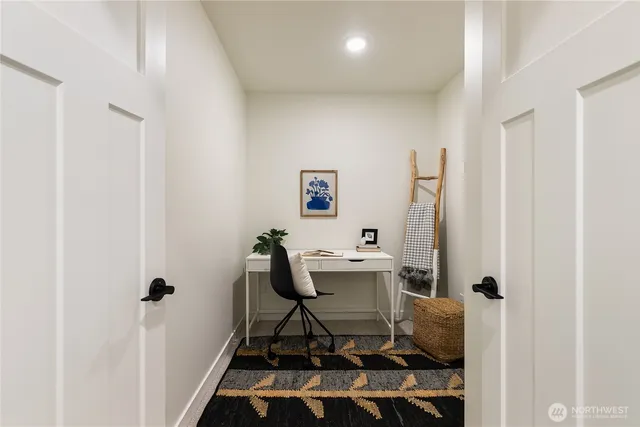 a workspace with furniture and a window