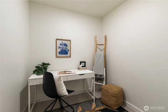 a view of a workspace with furniture