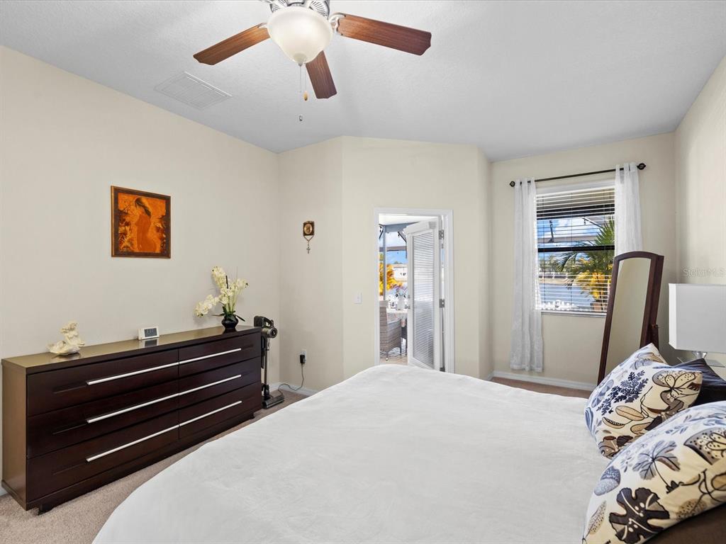 1716 Hadden Hall Place Trinity, FL 34655 - Photo 20 of 75 a bedroom with bed and wooden floor