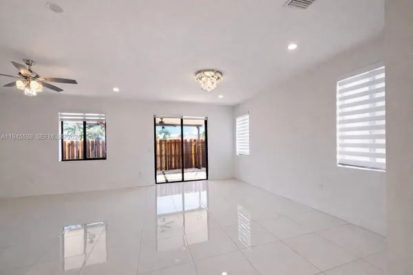 a bathroom with a shower sink mirror and toilet