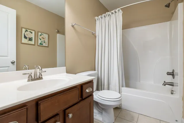a bathroom with a sink a toilet and a bathtub