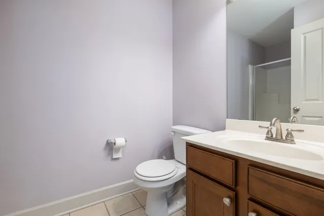 a bathroom with a sink a toilet and mirror