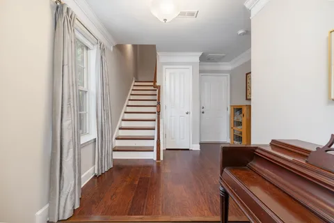 a view of room with wooden floor