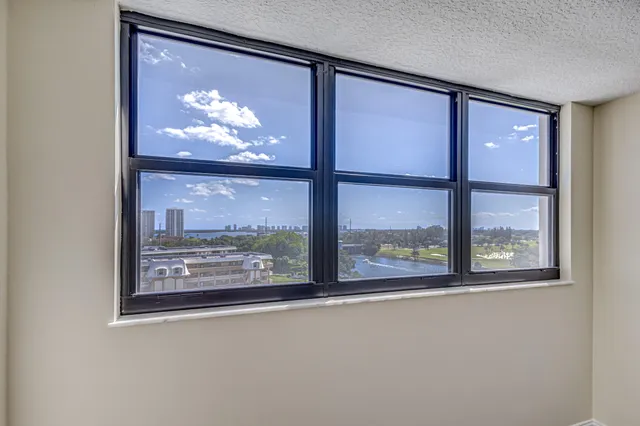 a view of swimming pool with outdoor seating and city view