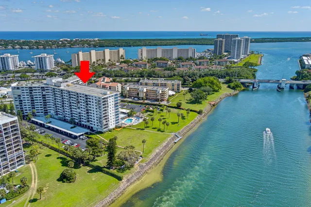 a view of a two room with a fireplace and a large window