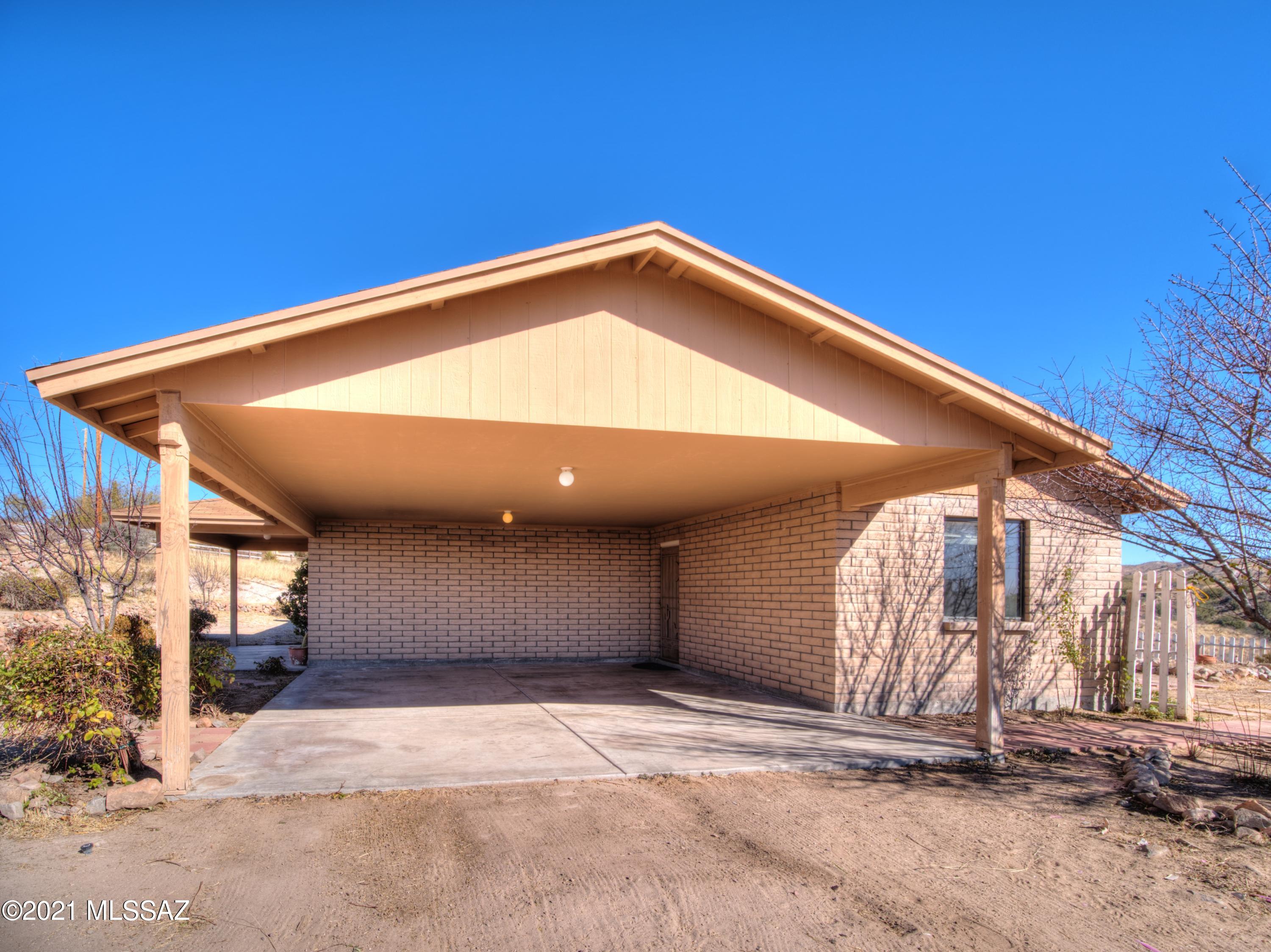 381 Tala Court Rio Rico, AZ 85648 - Photo 6 of 19 a view of a big room with a garage