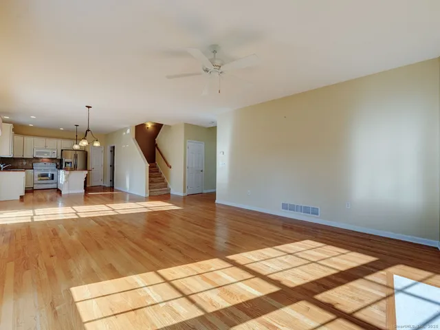 a view of an empty room with glass door
