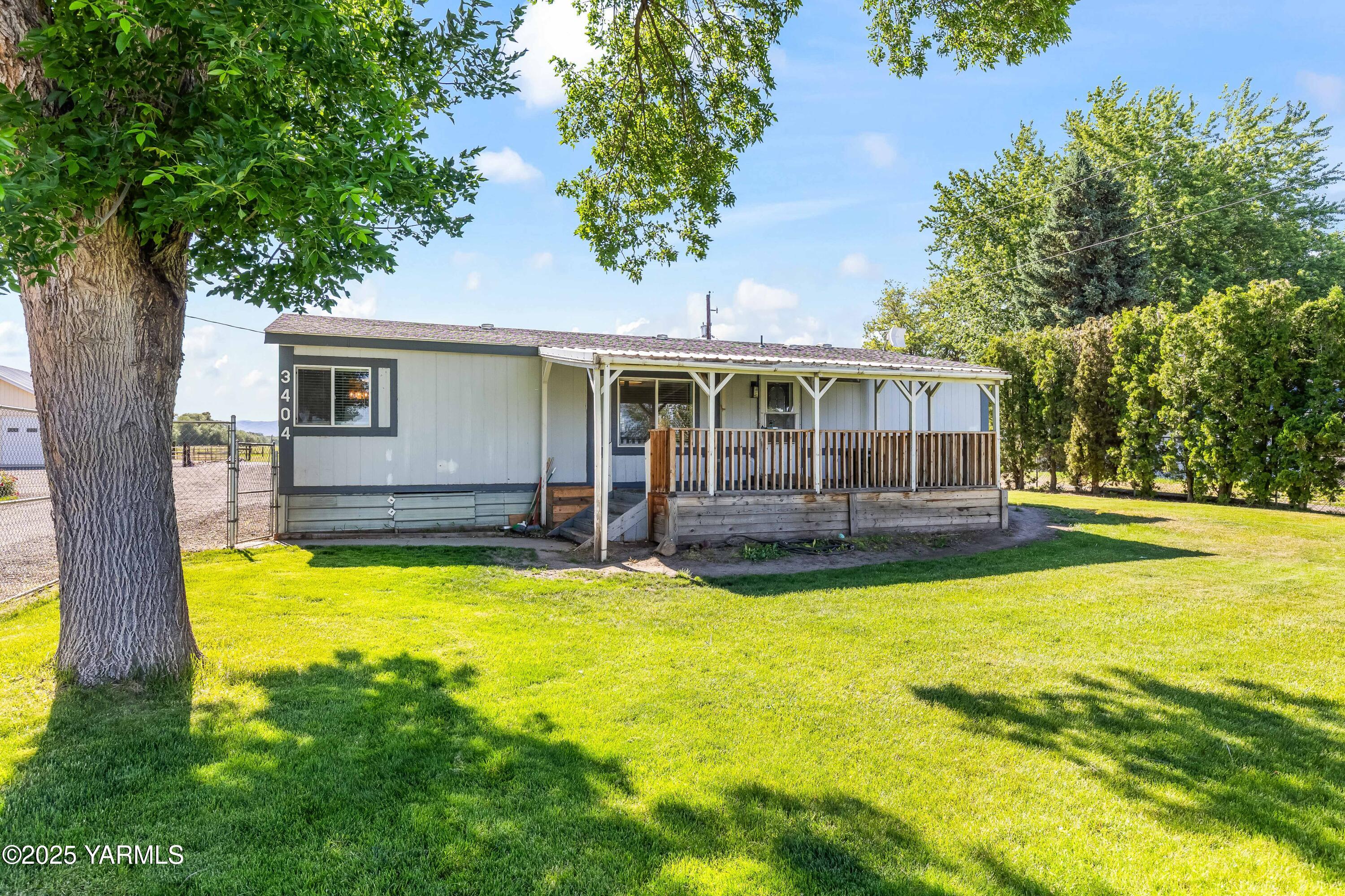 3404 Stanton Road Yakima, WA 98903 - Photo 1 of 37 a view of a house with swimming pool and porch with furniture