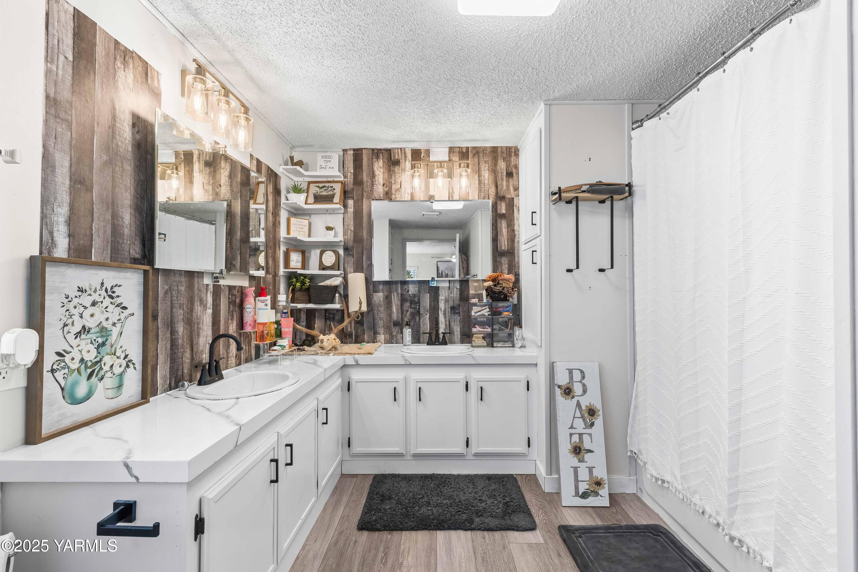 3404 Stanton Road Yakima, WA 98903 - Photo 14 of 37 a kitchen with a sink and a refrigerator