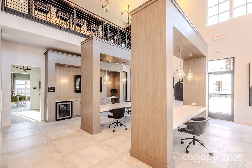 3110 Doe River Way, Unit WHITBY Matthews, NC 28105 - Photo 22 of 48 a view of a hallway with wooden floor and furniture