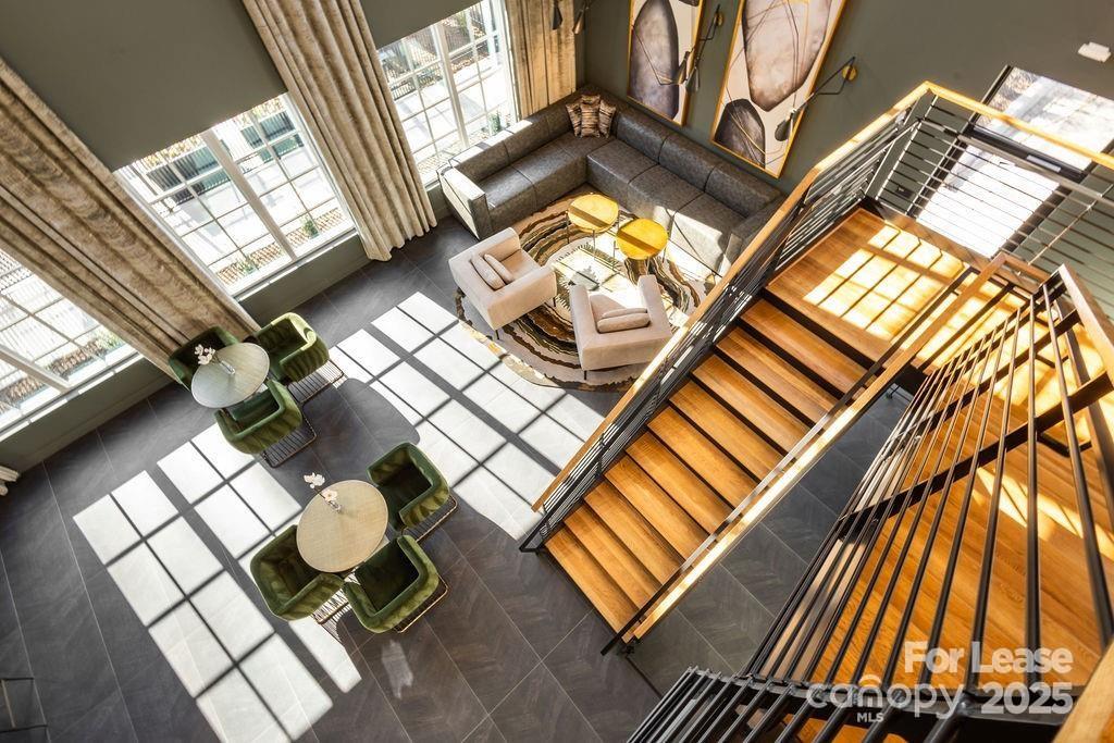 3110 Doe River Way, Unit WHITBY Matthews, NC 28105 - Photo 28 of 48 a living room with a rug