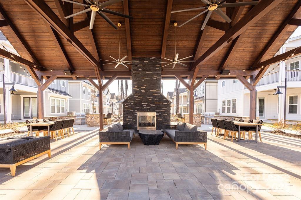 3110 Doe River Way, Unit WHITBY Matthews, NC 28105 - Photo 39 of 48 a view of a building with sitting area