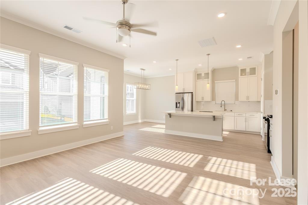 3110 Doe River Way, Unit WHITBY Matthews, NC 28105 - Photo 45 of 48 a spacious bathroom with a large mirror vanity and a shower