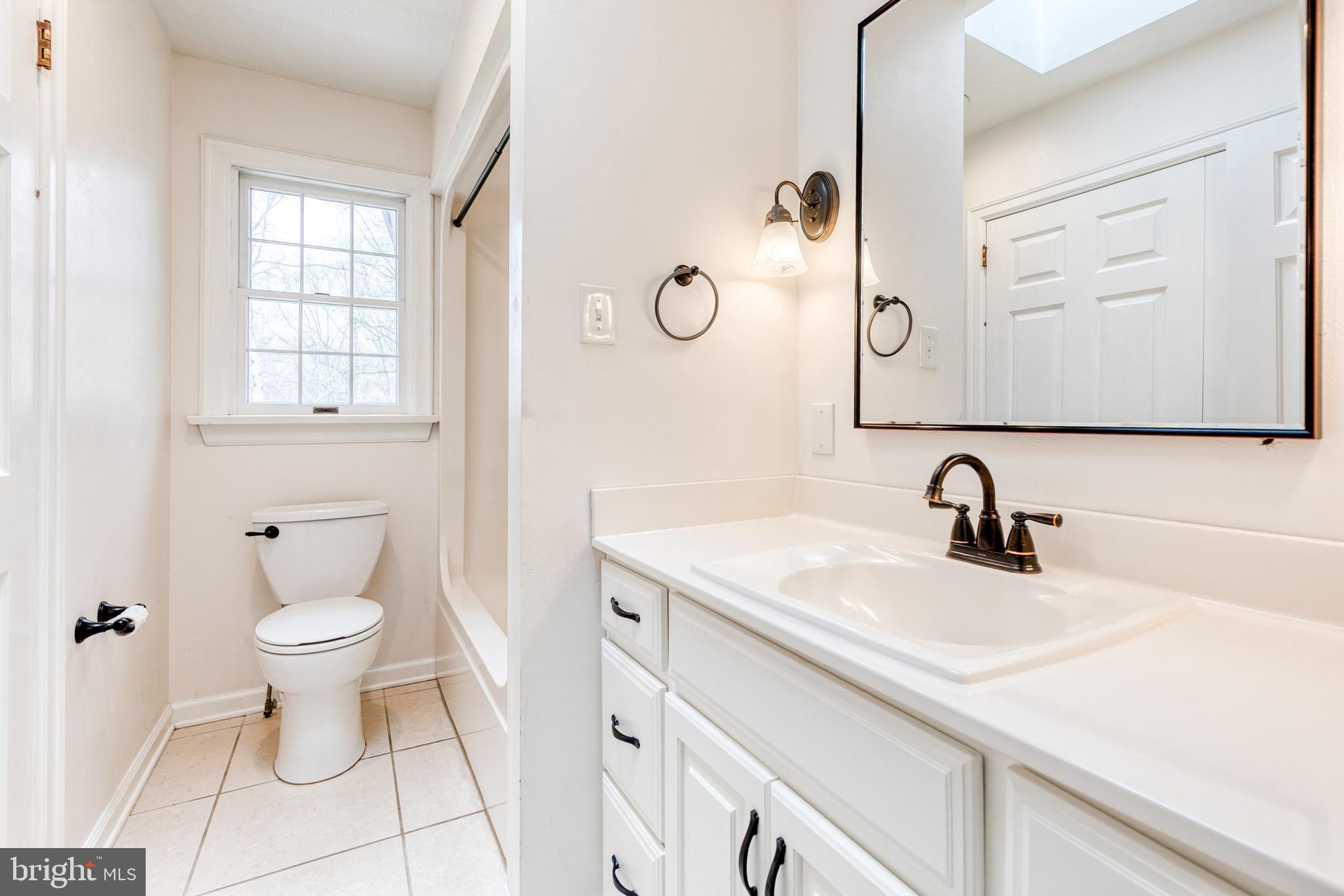 1216 Bonaire Road Forest Hill, MD 21050 - Photo 41 of 71 a bathroom with a toilet sink and mirror