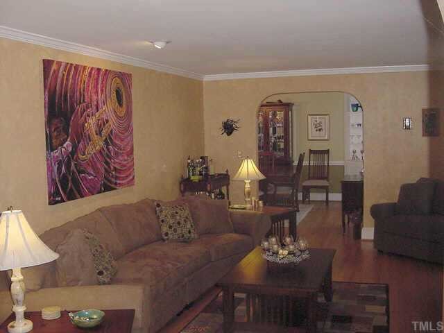 1101 Bancroft Street Raleigh, NC 27612 - Photo 3 of 10 a living room with furniture and painting on the wall