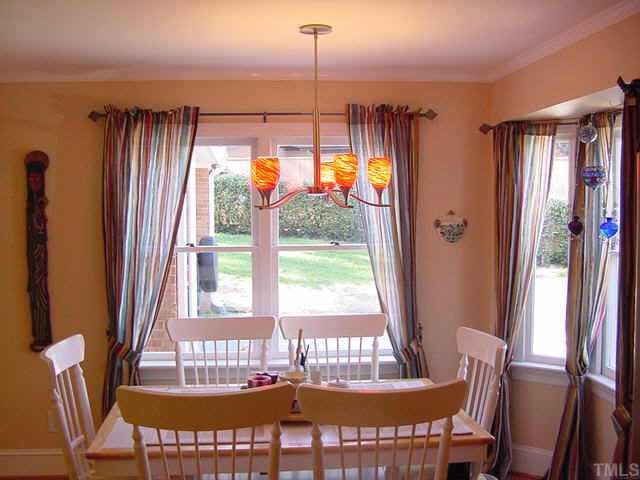 1101 Bancroft Street Raleigh, NC 27612 - Photo 5 of 10 a view of a dining room with furniture window and outside view