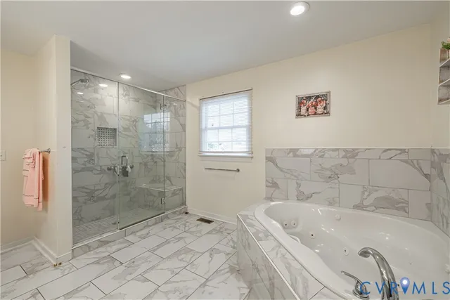 a bath tub sitting next to a white sink