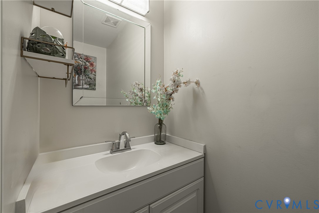 1920 Meadow Road Sandston, VA 23150 - Photo 14 of 30 a bathroom with a sink and a mirror