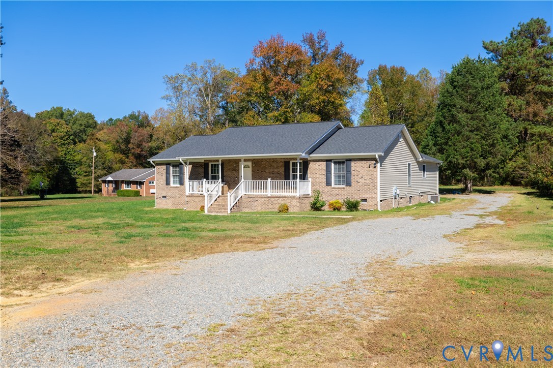 1920 Meadow Road Sandston, VA 23150 - Photo 17 of 30 a view of a house with a big yard and large trees