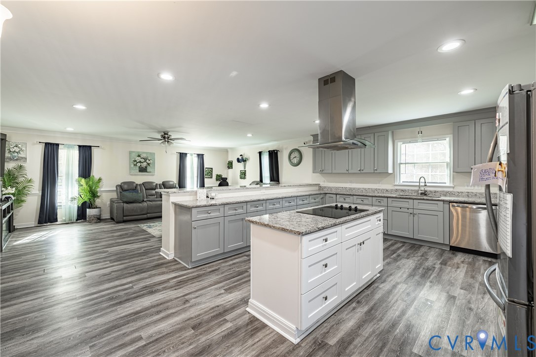 1920 Meadow Road Sandston, VA 23150 - Photo 30 of 30 a kitchen with granite countertop a sink cabinets and stainless steel appliances