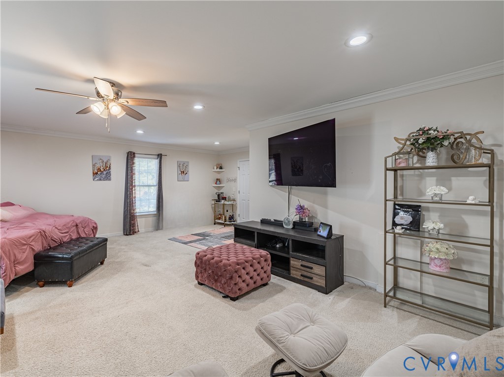 1920 Meadow Road Sandston, VA 23150 - Photo 8 of 30 a spacious bedroom with a bed and a flat screen tv