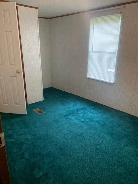 5552 Ferrum Mountain Road Callaway, VA 24067 - Photo 8 of 21 an empty room with a window