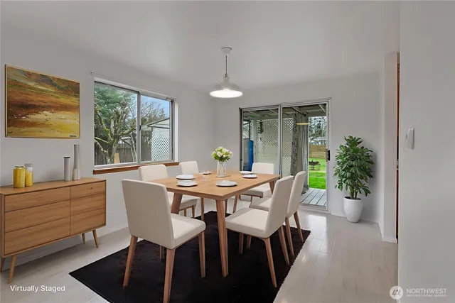 a view of a dining room with furniture window and outside view