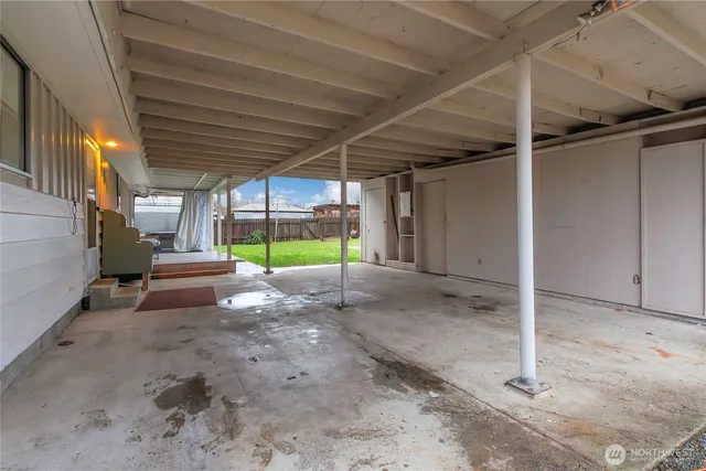 a view of a house with a yard and garage