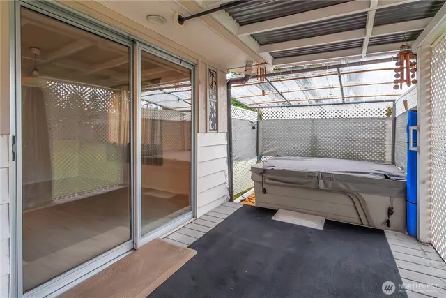 a view of a room with wooden floor