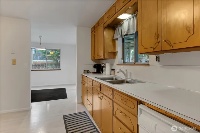 a kitchen with a sink and cabinets