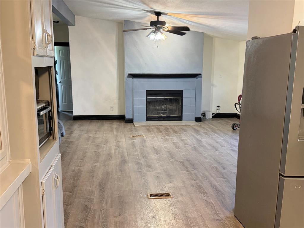 222 Hix Road Cleburne, TX 76031 - Photo 4 of 27 a view of empty room with fireplace