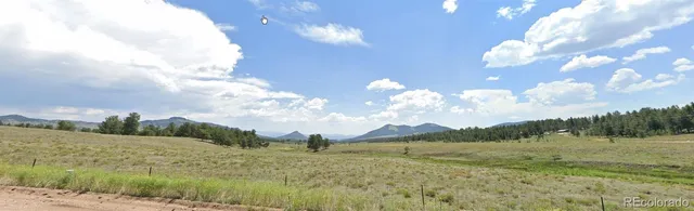 a view of lake with mountain