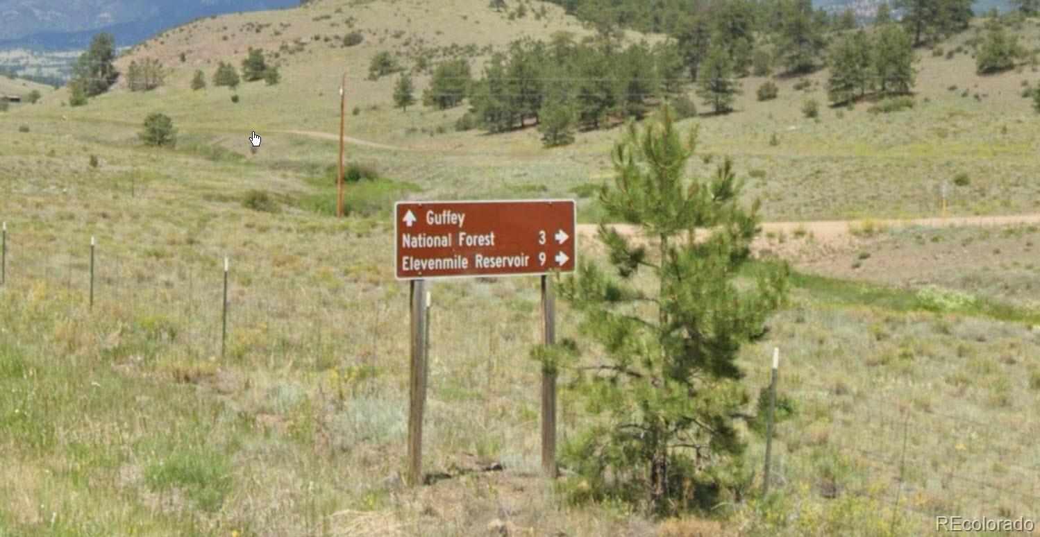 102 Co Guffey, CO 80820 - Photo 7 of 12 a sign that is sitting in front of a brick wall