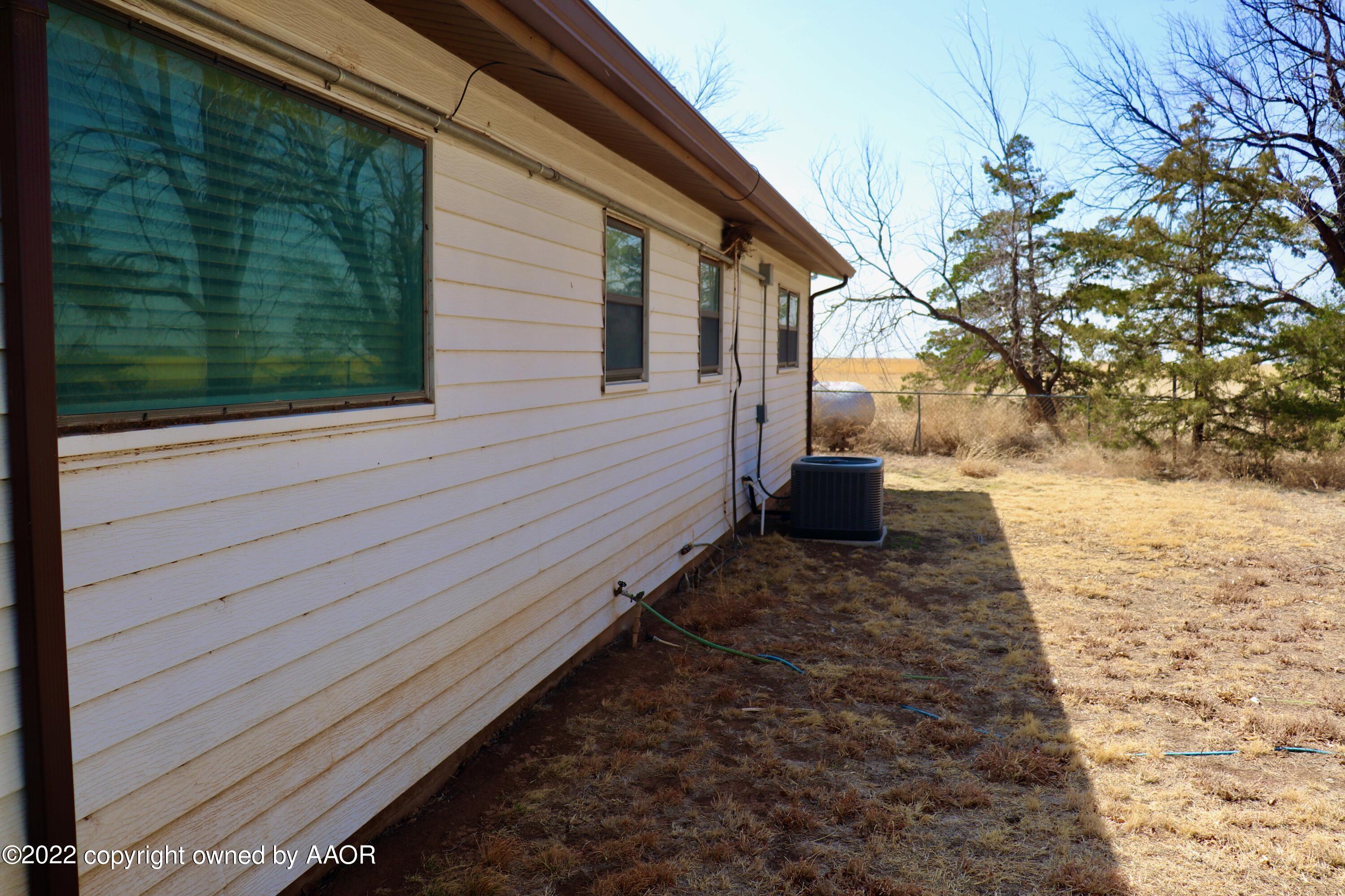 9540 Westline Road Wildorado, TX 79098 - Photo 15 of 61 a side view of a house with a yard