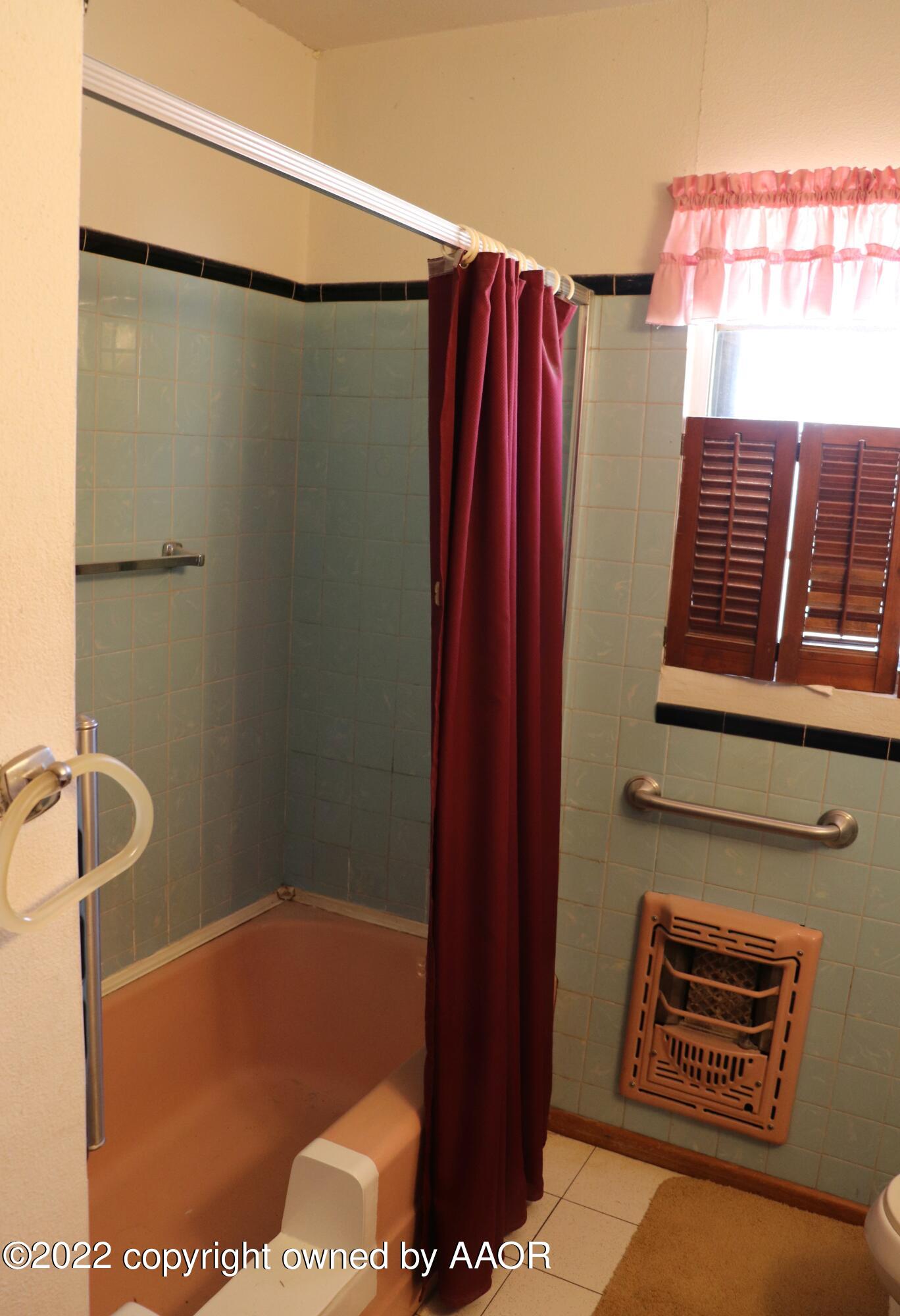 9540 Westline Road Wildorado, TX 79098 - Photo 57 of 61 a bathroom with a shower and a sink