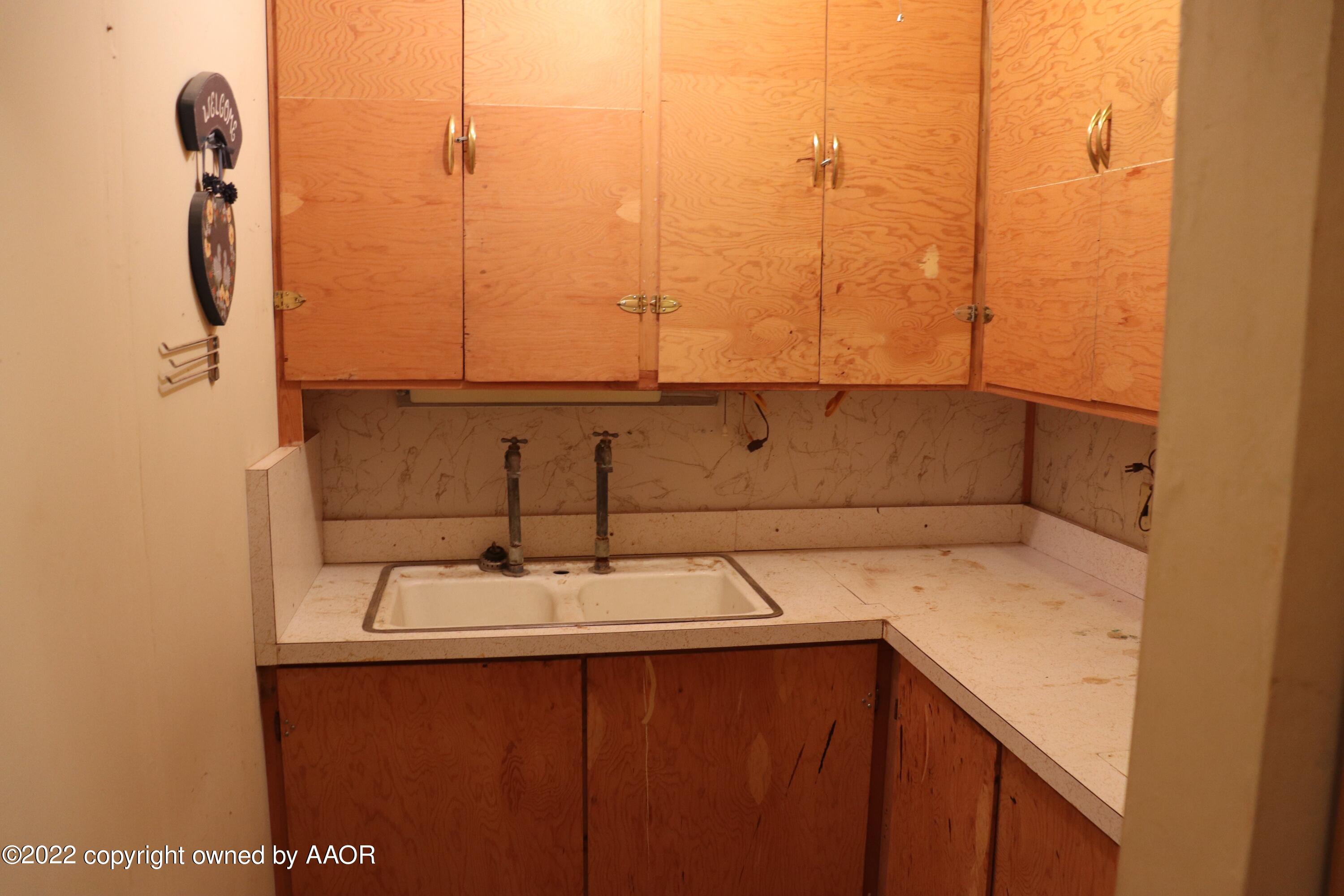 9540 Westline Road Wildorado, TX 79098 - Photo 10 of 61 a bathroom with a sink and washing machine