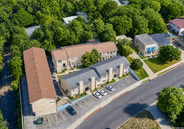 an aerial view of a house with outdoor space