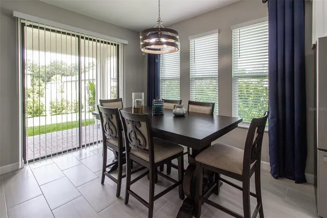 a kitchen with white cabinets and a sink