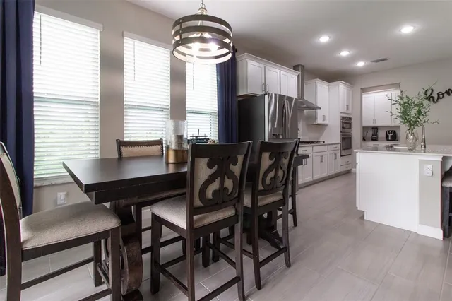 a kitchen with white cabinets and a sink