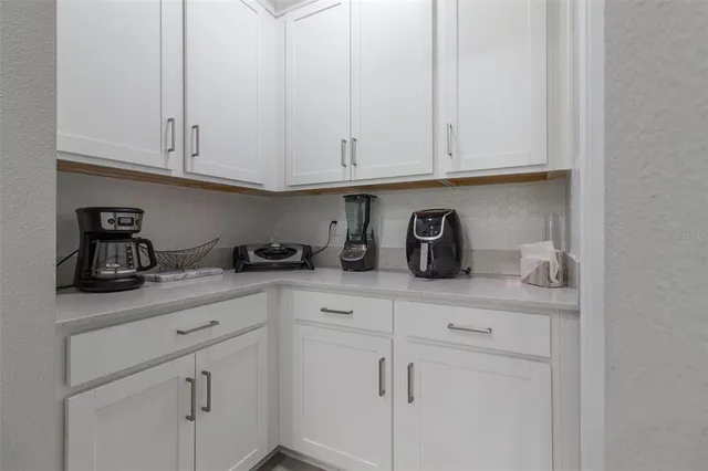 a bathroom with a double vanity sink and shower
