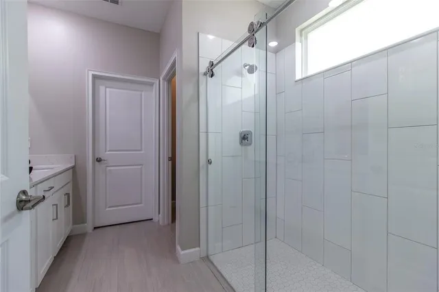 a en suite bathroom with a tub shower and sink