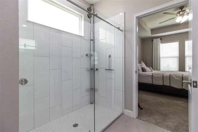 a view of a workspace with furniture and window